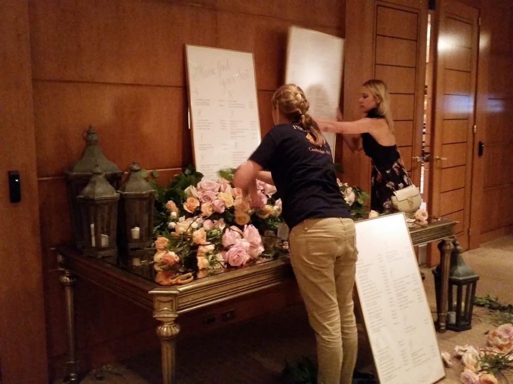 Repurposing the flowers from the ceremony chuppah for place card table